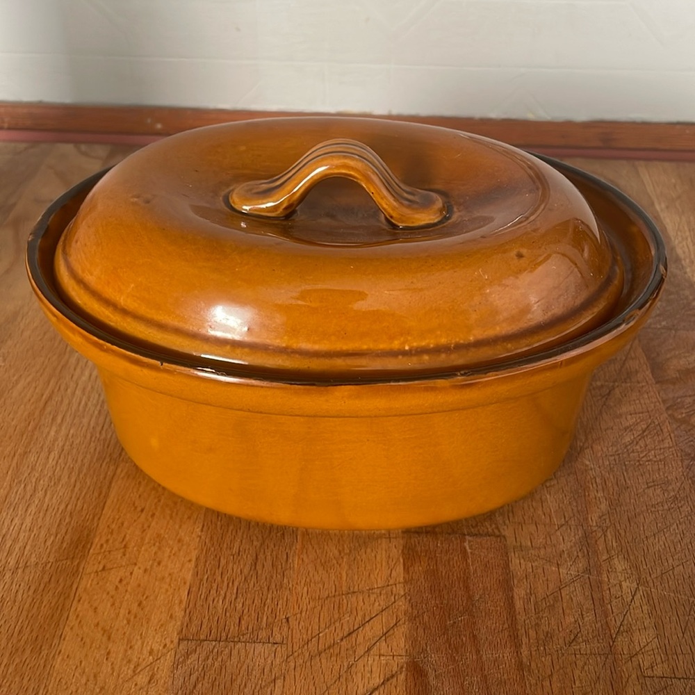 Ceramic small casserole dish with lid .
